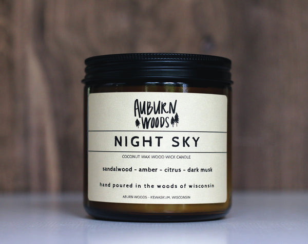 Night Sky candle is a mix of sandalwood - amber - citrus- dark musk. Large amber jar with lid. Coconut Wax candle with a crackling wooden wick. Made in Wisonson